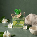 Degleri jasmine pure olive oil soap gift-wrapped in green organza with twine bow, surrounded by fresh white jasmine flowers — handmade in Greece