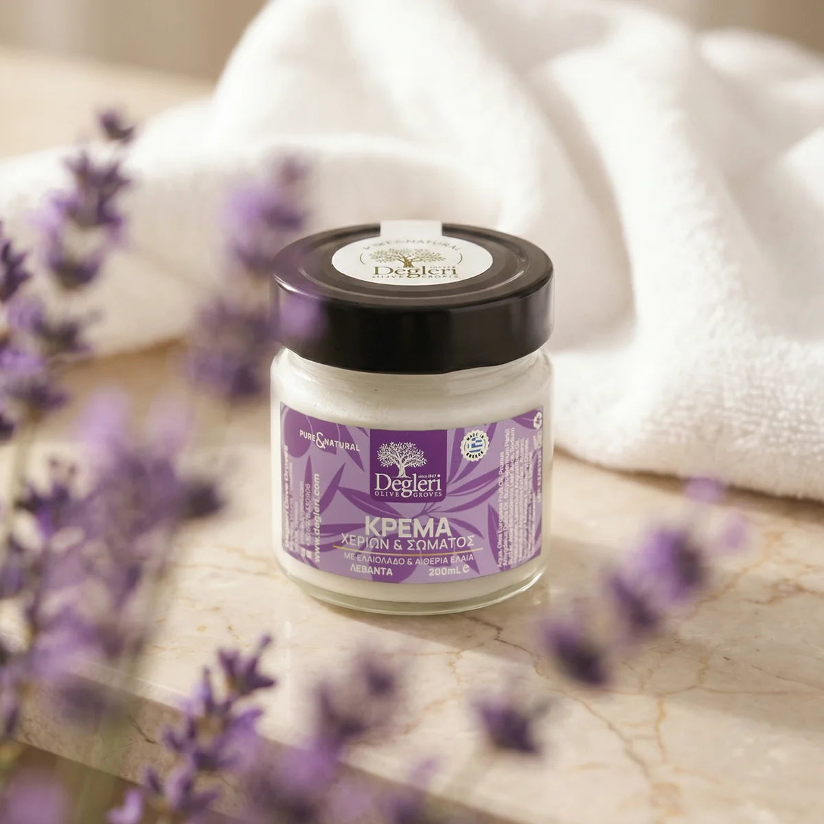 Degleri lavender hand and body cream jar with purple lavender flowers — natural Greek skincare made with olive oil