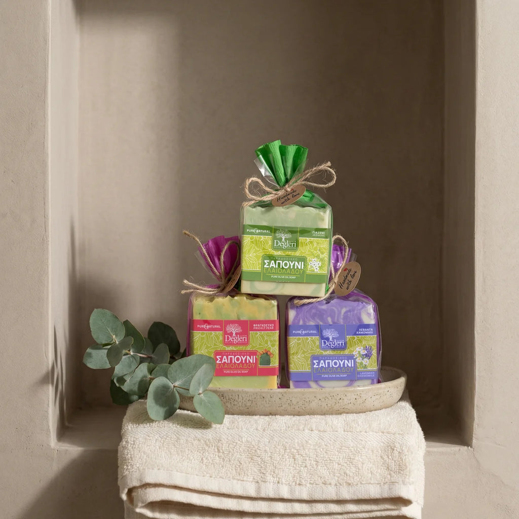 Degleri Greek olive oil soap gift set collection — jasmine, prickly pear and lavender varieties stacked in a rustic Mediterranean niche